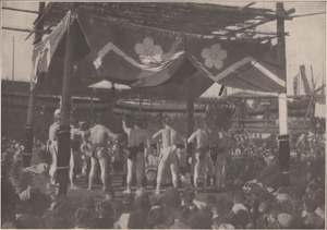 WRESTLERS AT A COUNTRY FAIR